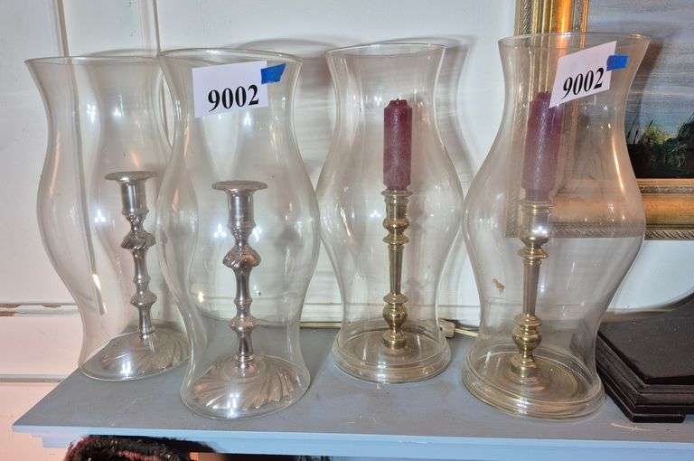 Two pairs of candlesticks with hurricane shades