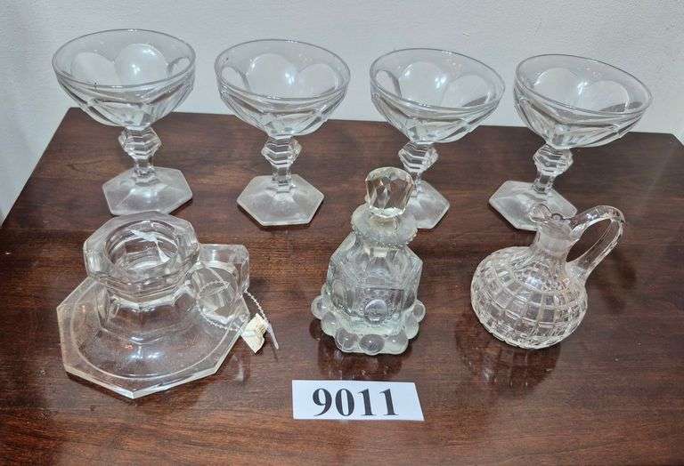 Set of four Heisey stems, two cruets, candle holder