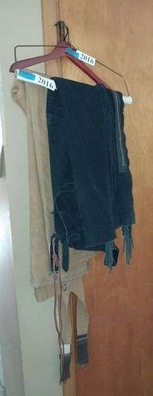 Carhartt overalls, black suede chaps with fringe