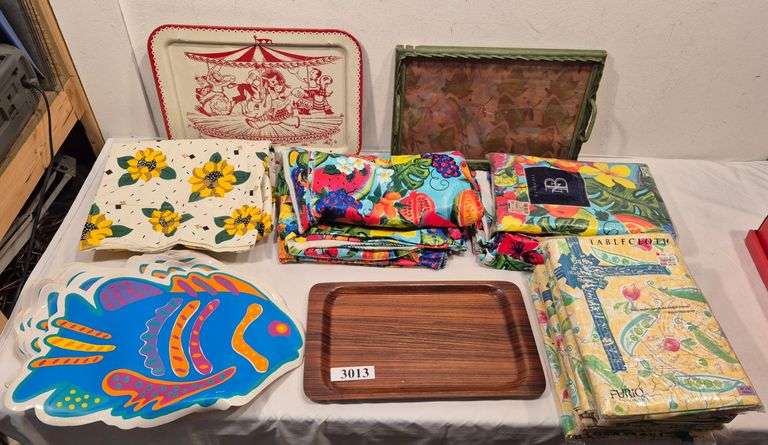 Plastic tablecloths, placemats, wood, metal, and wicker serving trays