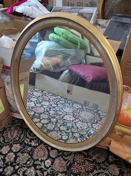 Gold frame oval mirror