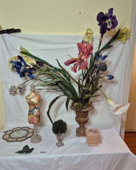 Metal urn with plastic flowers, stained glass window hangings, Etc