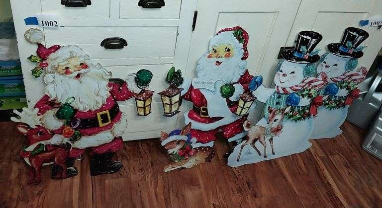 Metal cut out Santas and snowmen with stands