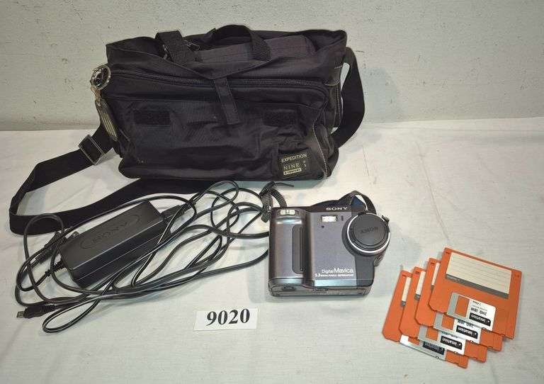 Vintage Sony digital Mavica digital camera with power supply and floppy disks in case.