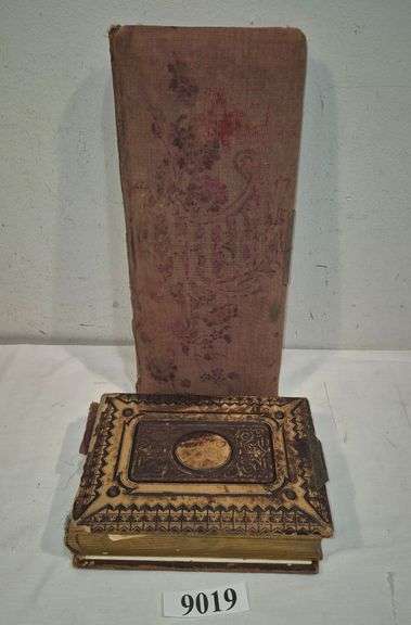 Two Victorian photo albums, one mostly full of portrait photos