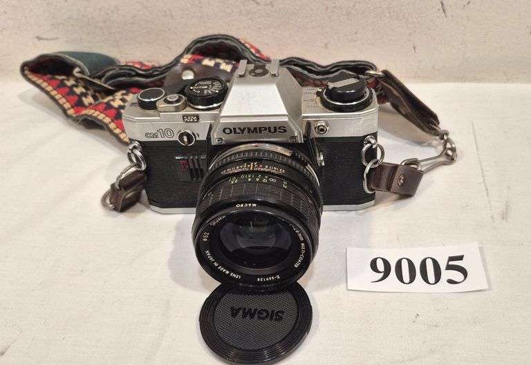 Olympus OM10 35mm SLR camera with Sigma wide-angle lens