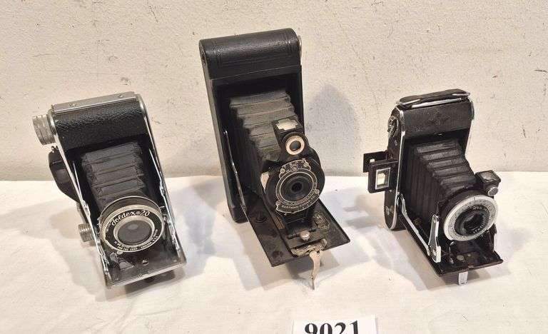 Three folding cameras
