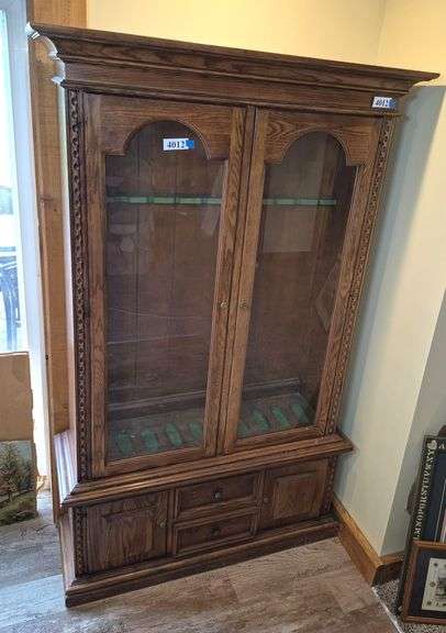 Two-piece Oak gun cabinet with key