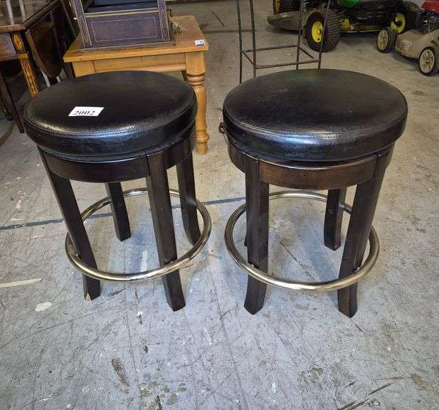 Pair of black swivel bar stools