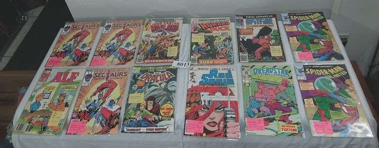 12 Marvel Comic books in plastic sleeves