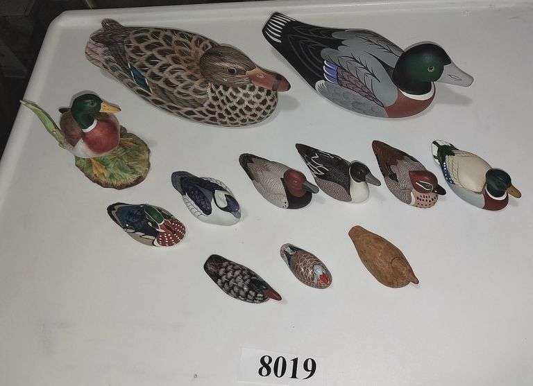 Wood and resin duck figurines
