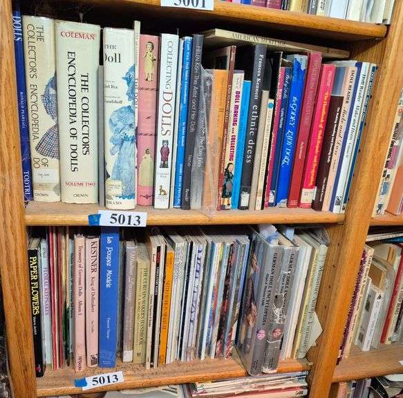 Two shelves of doll, doll clothes books, dollhouse books