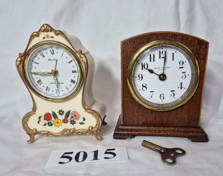 Small Seth Thomas wood case key wind clock, plastic case musical alarm
