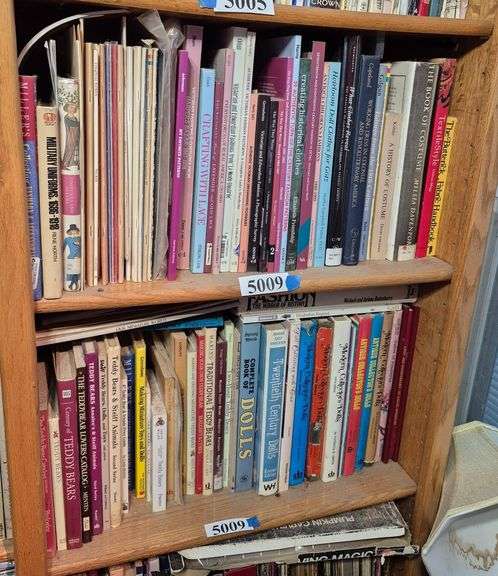 Two shelves of books including doll books, doll clothes books, teddy bear books, Etc
