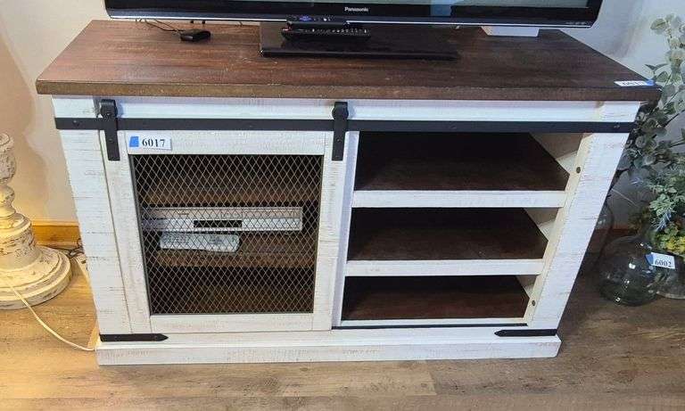 Farmhouse style TV stand with sliding metal mesh door