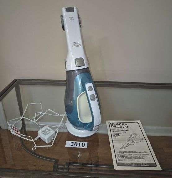 Black & Decker 16 volt cordless hand vac with charger cradle and manual