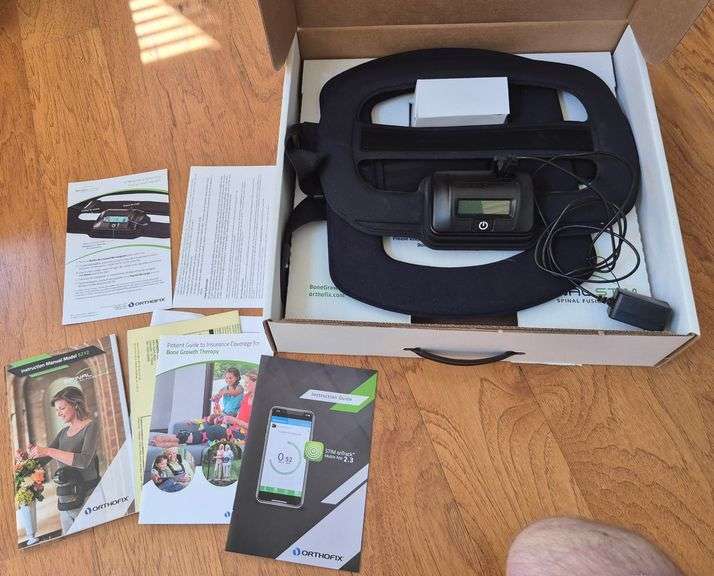 Orthofix spinal stim spinal fusion therapy model 5212 in box with charger and manuals