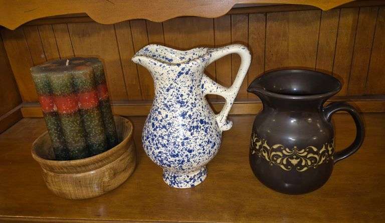 Two ceramic pitchers, wood bowl, candle