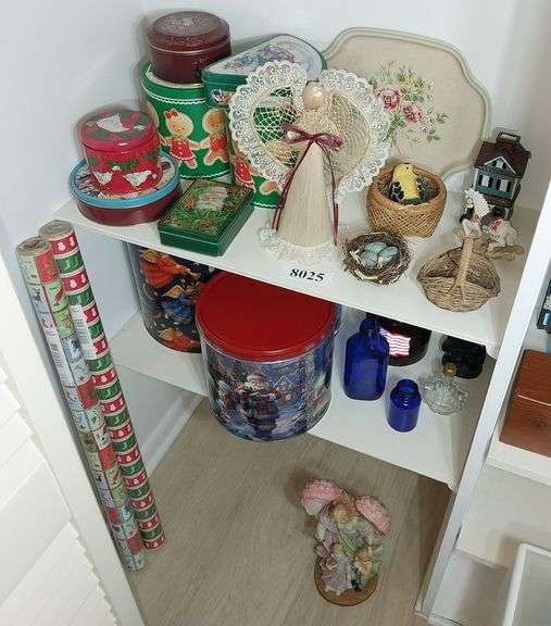 Tins, bottles, resin Angel and rocking horse figurines, wrapping paper, ceramic house tea light hold