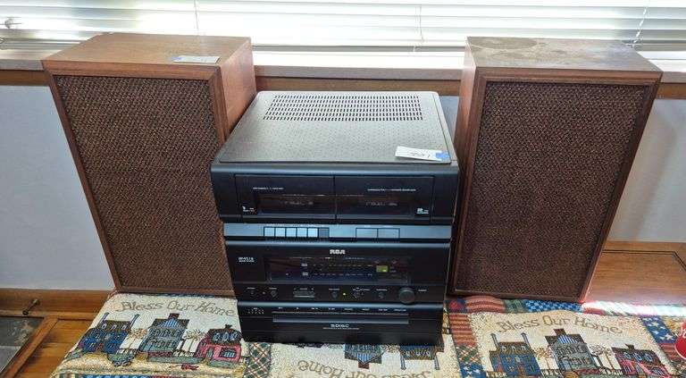 RCA compact stereo with five disc CD changer, two wood bookshelf speakers