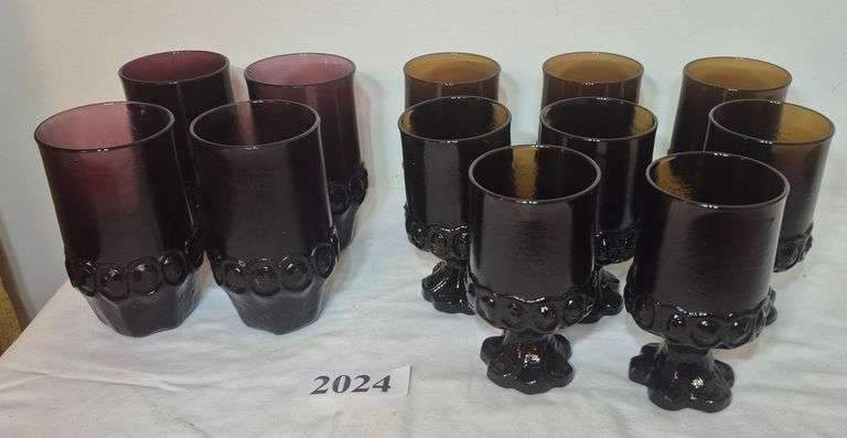 Mid-century purple glass drinking glasses and brown glass footed glasses / goblets