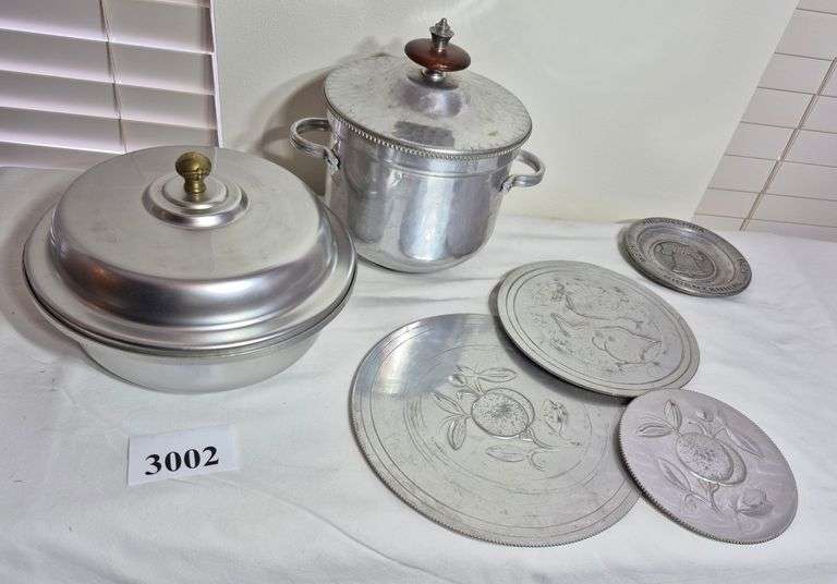 Covered dish, ice bucket, small pewter bicentennial plate, trivets, lazy susan