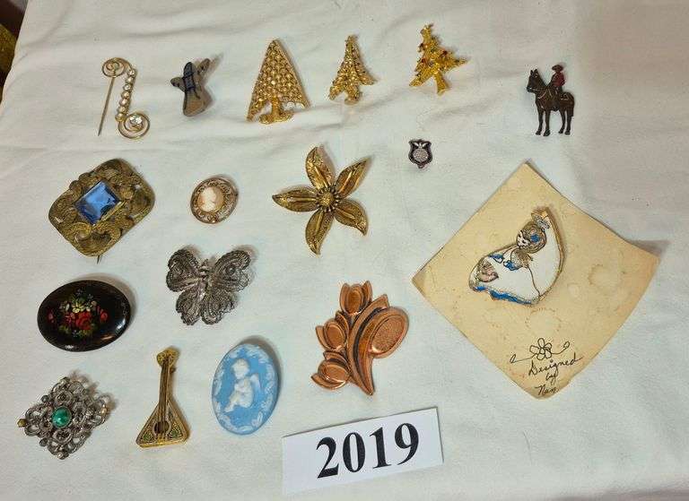 Costume jewelry pins and brooches