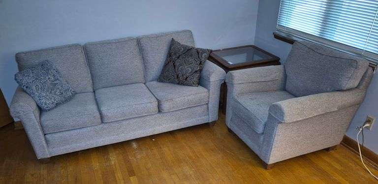 Light gray Smith Brothers sofa and armchair with accent pillows