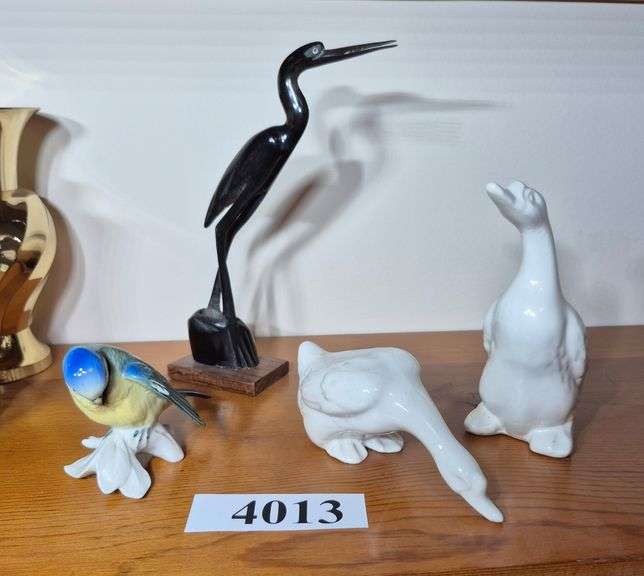 Ceramic, porcelain, and carved horn bird figurines