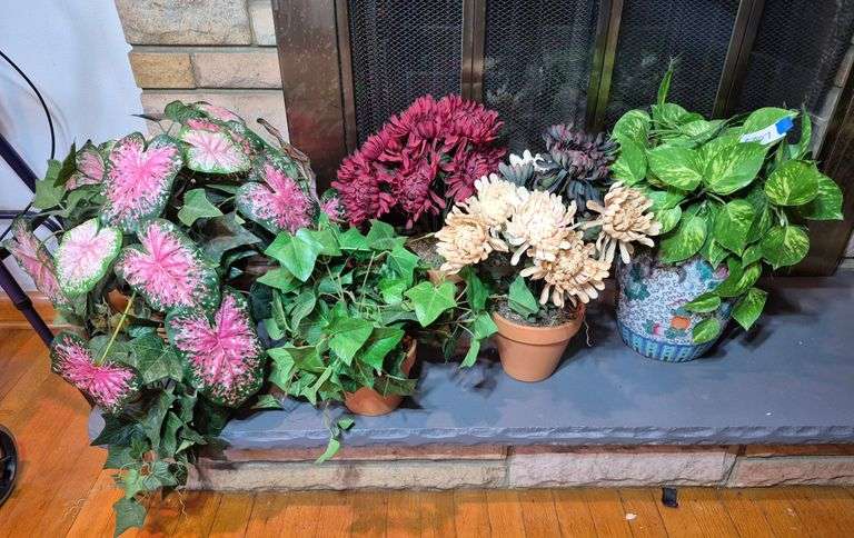 Artificial flowers and plants in planters / vases