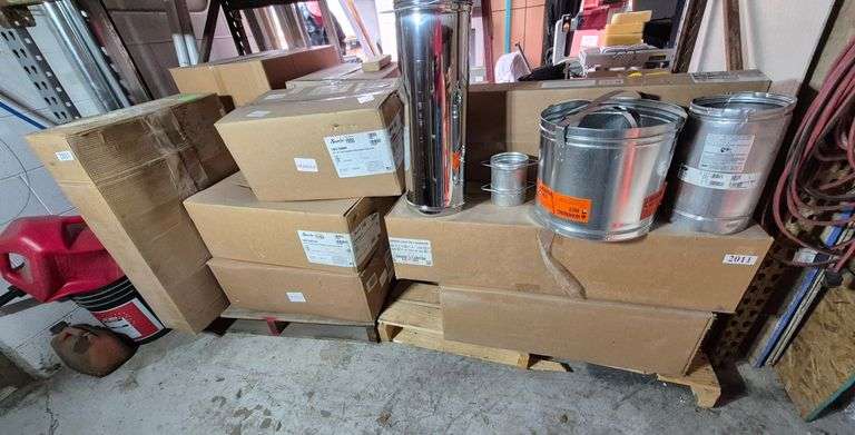 Inventory on bottom shelf including burners, fireplace logs, vents, etc.