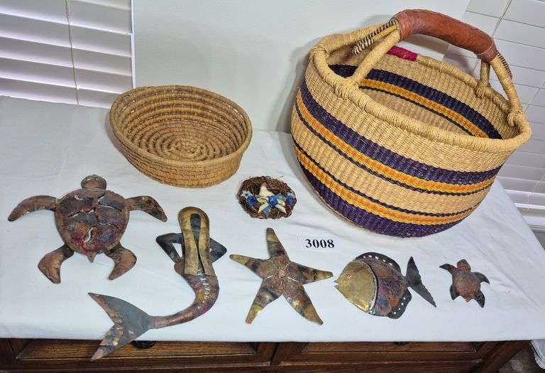 Baskets, metal turtle, fish, and mermaid wall hangings