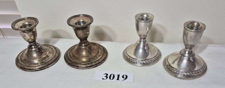 Two pairs of Sterling silver weighted candle holders