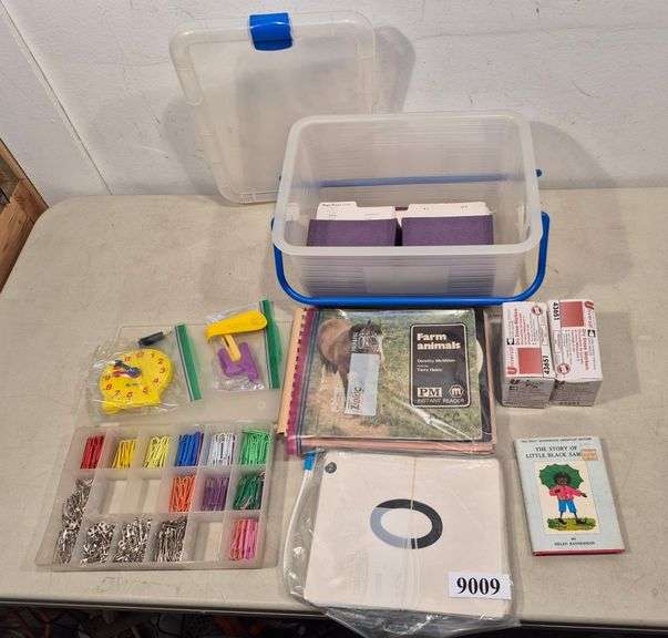 Educational materials, children's books, office supplies, clear plastic tote