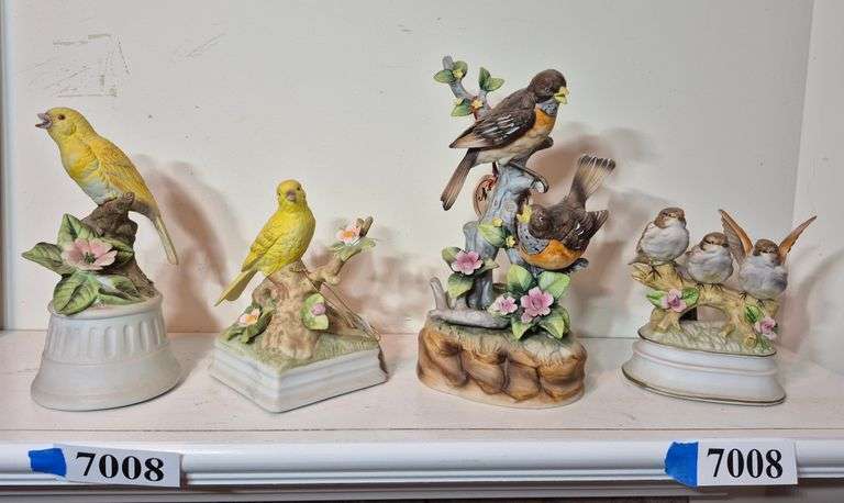 Four ceramic bird figurine music boxes