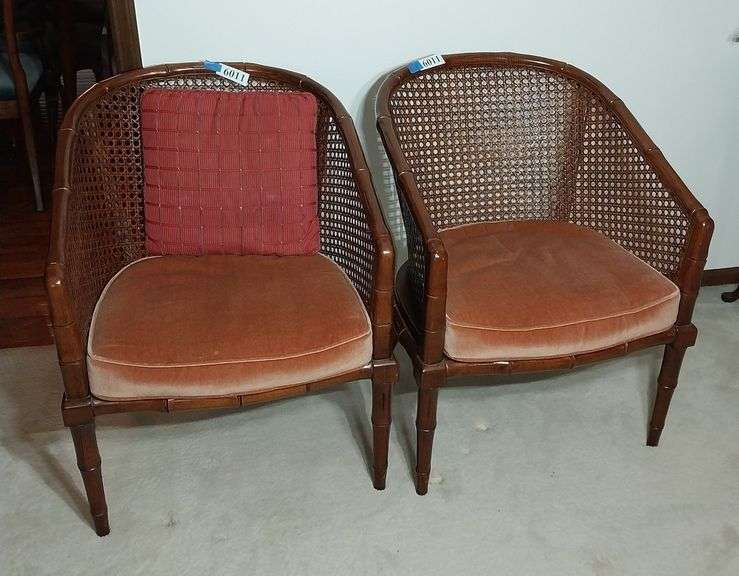 Pair of cane and wood arm chairs with cushions