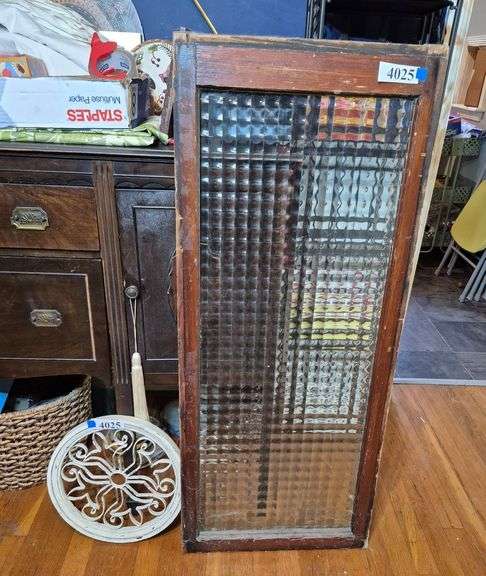 Antique window pane with textured geometric glass, round wood and metal wall hanging