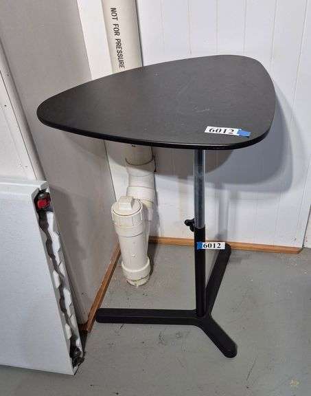 Adjustable height black triangular table