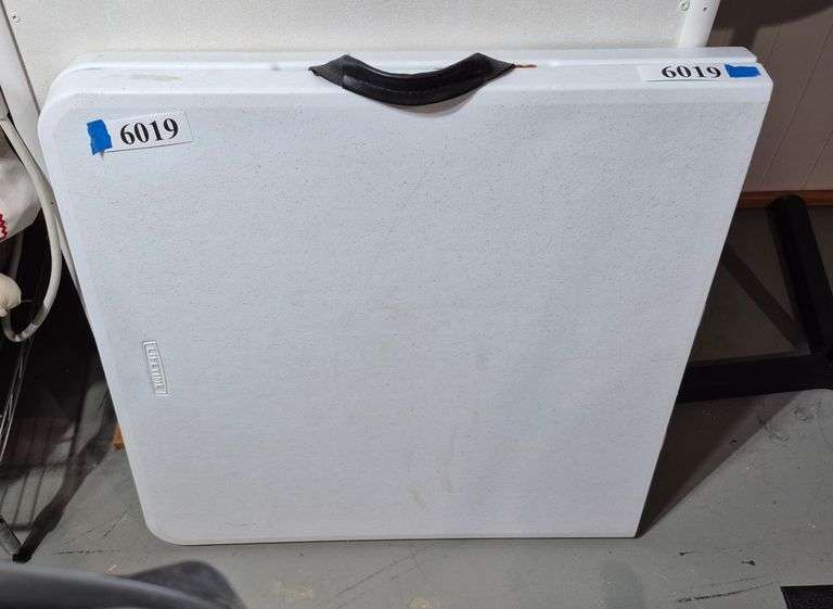 Lifetime white plastic 4 ft fold-in-half folding table