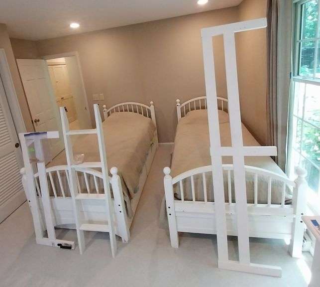 White twin beds/bunk beds, mattresses, ladder, railings, NO bedding