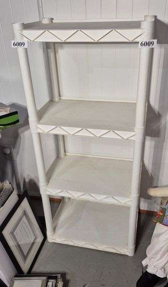 Small white plastic utility shelf