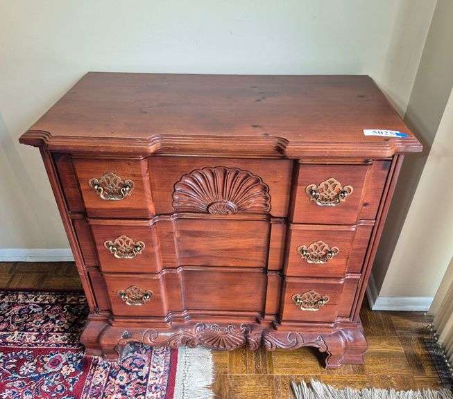 Block front three drawer chest with shell carvings