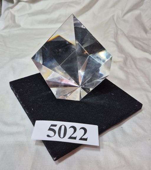 Crystal prism paperweight on rotating black stand