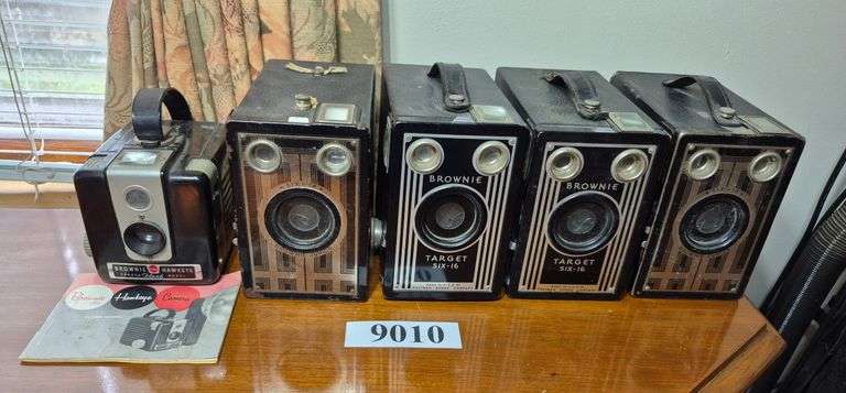Four antique Kodak box cameras, brownie hawkeye plastic camera