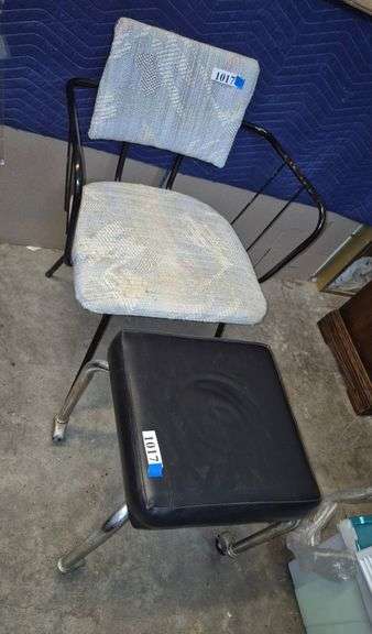 Mid-century chair with black metal frame, rolling Chrome ottoman with black cushion