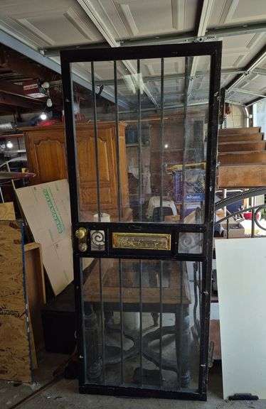Security storm door with mail slot