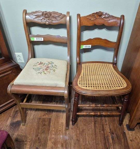 Two antique carved back chairs, one with needlepoint seat, one with cane seat