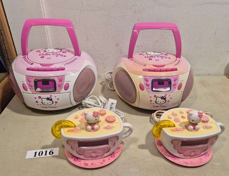 Two Hello Kitty boomboxes, two Hello Kitty clock radios