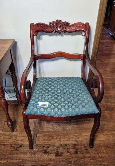 Armchair with carved crest