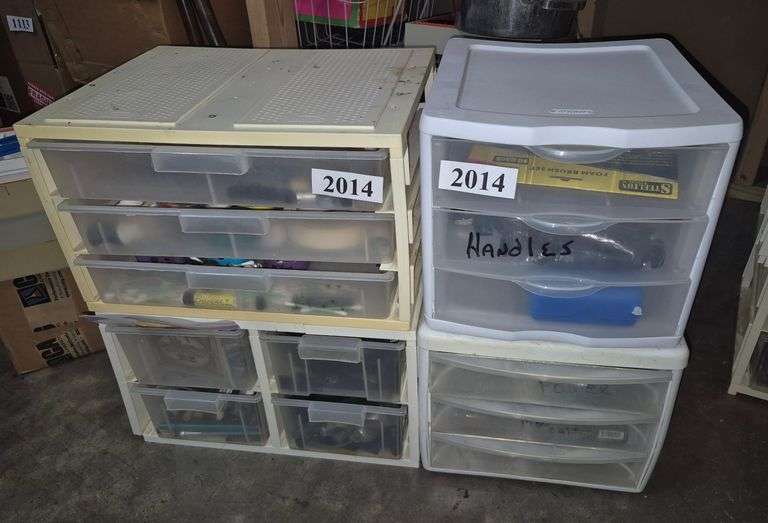 Organizers with guitar and amplifier parts, knobs, batteries, Etc